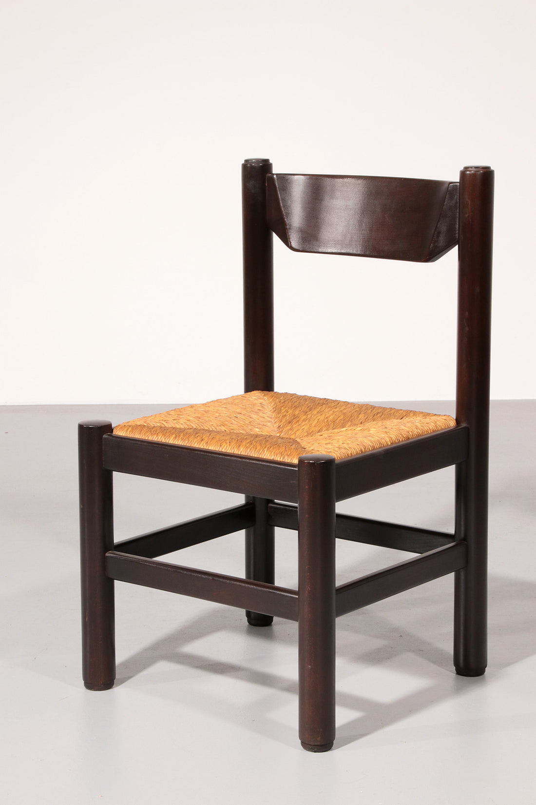 Dining Set inspired by Vico Magistretti, featuring six elegantly re-caned chairs and table.
